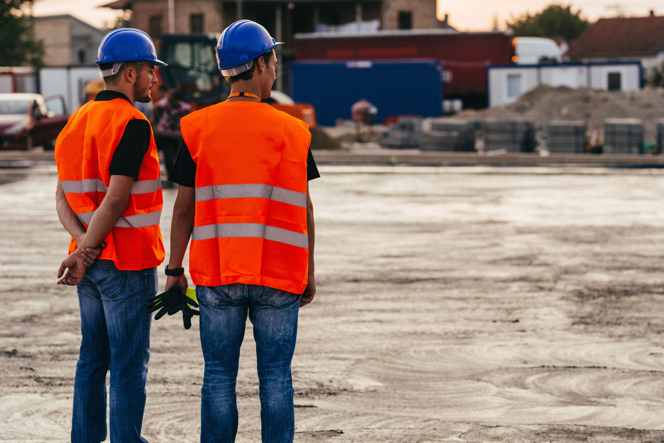 Manual Workers in front of concreted ground